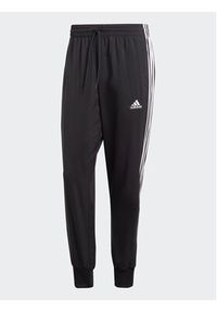 Adidas - adidas Spodnie dresowe AEROREADY Essentials Tapered Cuff Woven 3-Stripes Joggers IC0041 Czarny Regular Fit. Kolor: czarny. Materiał: syntetyk #3