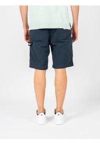 TOMMY HILFIGER - Tommy Jeans Szorty "Skater Jean Loose" | DM0DM13226 | Mężczyzna | Granatowy. Stan: podwyższony. Kolor: niebieski. Materiał: bawełna, elastan. Wzór: aplikacja