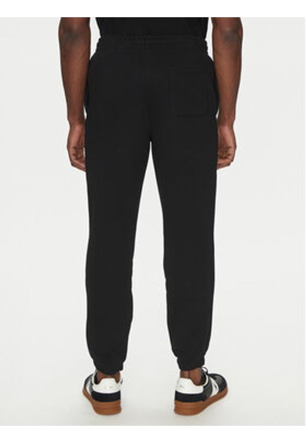 Lacoste Spodnie dresowe XH2750 Czarny Regular Fit. Kolor: czarny. Materiał: bawełna