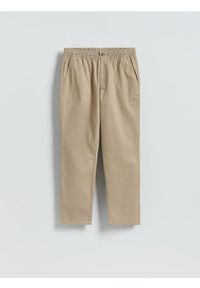 Reserved - Spodnie jogger slim - beżowy. Kolor: beżowy. Materiał: tkanina, bawełna