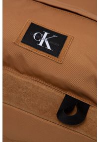 Calvin Klein Jeans plecak męski kolor brązowy duży gładki. Kolor: brązowy. Materiał: materiał, włókno. Wzór: gładki