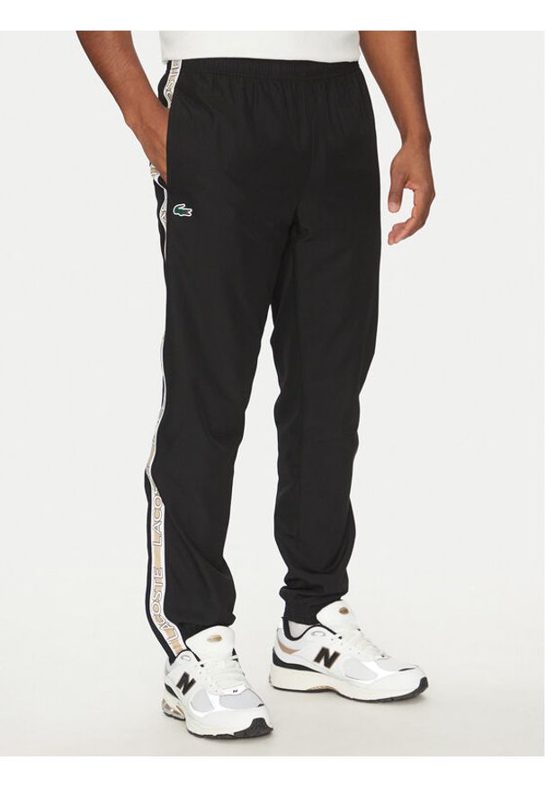 Lacoste Spodnie dresowe XH8974 Czarny Relaxed Fit. Kolor: czarny. Materiał: syntetyk