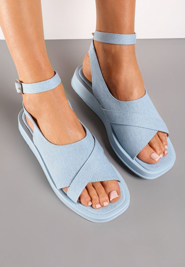 Renee - Jasnoniebieskie Sandały Na Płaskiej Podeszwie z Szerokim Zapinanym Paskiem Imarra. Zapięcie: pasek. Kolor: niebieski. Obcas: na płaskiej podeszwie