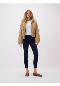 Reserved - Jeansy slim - granatowy. Kolor: niebieski