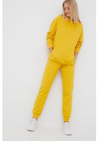 Jack Wolfskin spodnie dresowe bawełniane damskie kolor żółty gładkie. Kolor: żółty. Materiał: bawełna, dresówka. Wzór: gładki #4