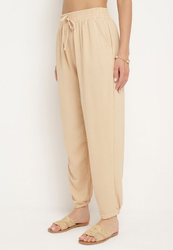 Born2be - Beżowe Dresowe Spodnie z Gumką w Pasie i Wysokim Stanem Dimrou. Stan: podwyższony. Kolor: beżowy. Materiał: dresówka. Długość: długie. Styl: elegancki