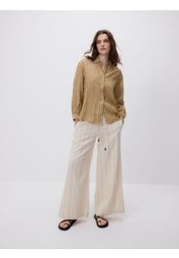 Reserved - Luźne spodnie z domieszką lnu - kremowy. Kolor: kremowy. Materiał: len #1