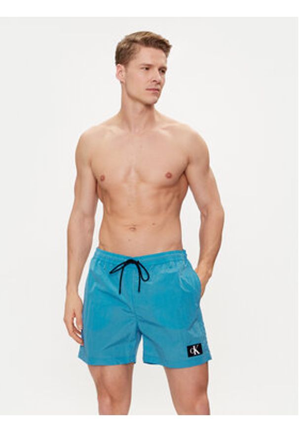 Calvin Klein Swimwear Szorty kąpielowe KM0KM00980 Niebieski Regular Fit. Kolor: niebieski. Materiał: syntetyk