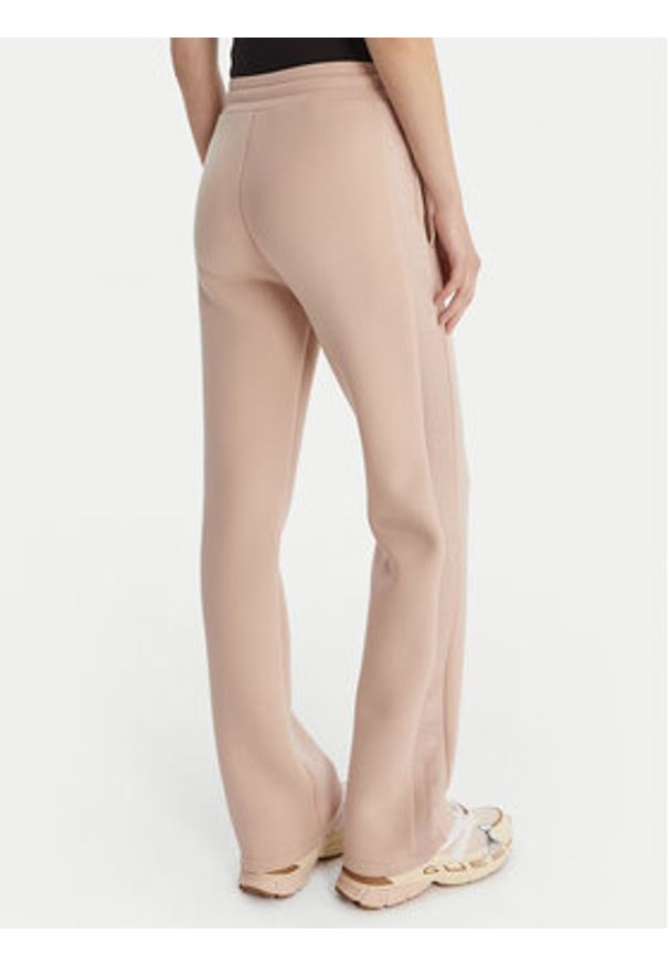 Guess Spodnie dresowe V3RB21 K7UW2 Beżowy Regular Fit. Kolor: beżowy. Materiał: syntetyk