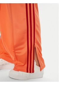 Adidas - adidas Spodnie dresowe adicolor Classic Firebird JP2309 Pomarańczowy Loose Fit. Kolor: pomarańczowy. Materiał: syntetyk #4