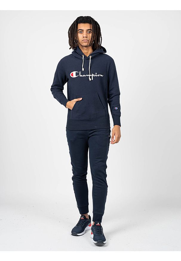 Champion Bluza | 212574 | Mężczyzna | Granatowy. Okazja: na co dzień. Typ kołnierza: kaptur. Kolor: niebieski. Materiał: bawełna. Wzór: aplikacja. Styl: casual