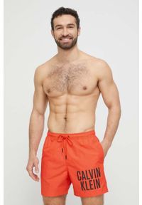 Calvin Klein szorty kąpielowe kolor pomarańczowy. Kolor: pomarańczowy. Materiał: tkanina, poliester, materiał #1