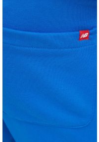 New Balance spodnie dresowe męskie z nadrukiem. Kolor: niebieski. Materiał: dresówka. Wzór: nadruk