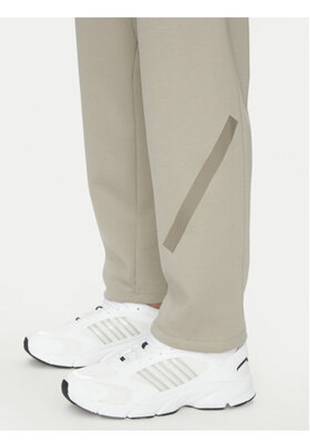 Adidas - adidas Spodnie dresowe Z.N.E. Open-Hem JC6716 Beżowy Loose Fit. Kolor: beżowy. Materiał: bawełna