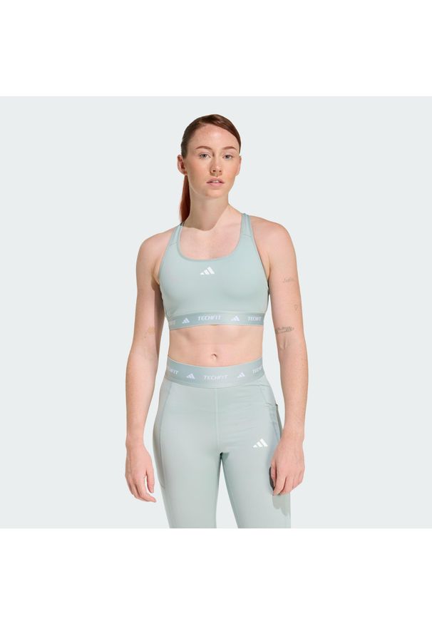 Adidas - Biustonosz TECHFIT. Kolor: zielony. Materiał: materiał. Technologia: Techfit (Adidas). Sport: fitness