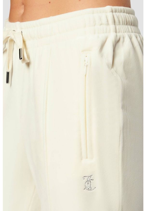 Juicy Couture - JUICY COUTURE Kremowe spodnie dresowe damskie z cyrkoniami Tina, Rozmiar S. Kolor: beżowy. Materiał: dresówka. Wzór: aplikacja