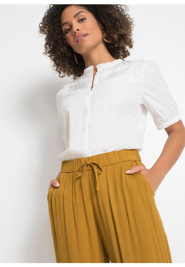 bonprix - Spodnie Marlena z lejącej wiskozy. Kolor: żółty. Materiał: wiskoza