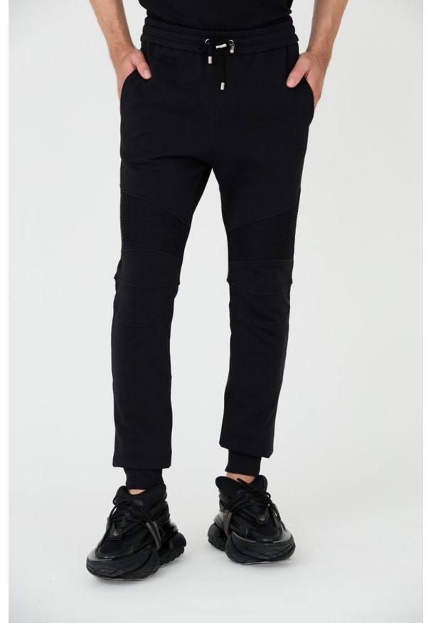 Balmain - BALMAIN Czarne męskie spodnie dresowe Ribbed Flock Sweatpants, Rozmiar L. Kolor: czarny. Materiał: dresówka