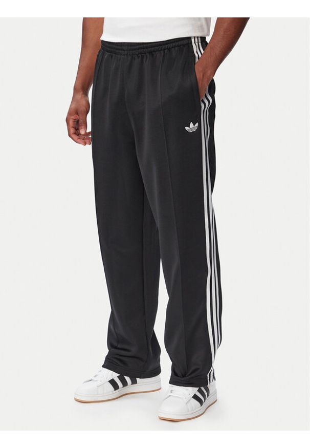 Adidas - adidas Spodnie dresowe adicolor Spacer KS7433 Czarny Baggy Fit. Kolor: czarny. Materiał: bawełna. Sport: turystyka piesza