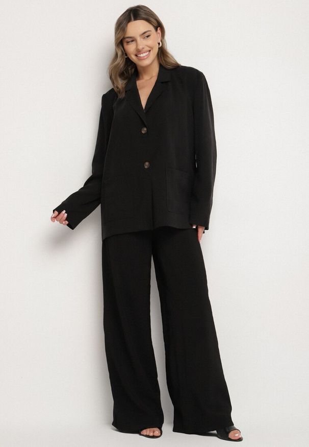 Born2be - Czarne Spodnie z Modalu o Szerokim Kroju z Niskim Stanem Reavela. Okazja: na co dzień. Stan: obniżony. Kolor: czarny. Styl: elegancki, casual, klasyczny