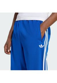 Adidas - adidas Spodnie dresowe adicolor Firebird KD4079 Niebieski Regular Fit. Kolor: niebieski. Materiał: syntetyk #3