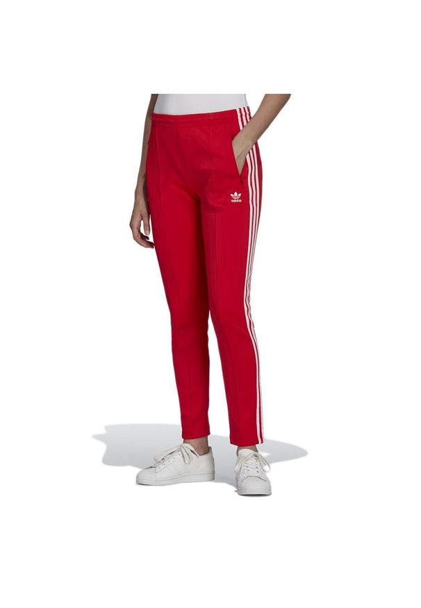 Adidas - Spodnie dresowe adidas Originals Primeblue SST Track HF1992 - czerwone. Kolor: czerwony. Materiał: dresówka. Wzór: aplikacja