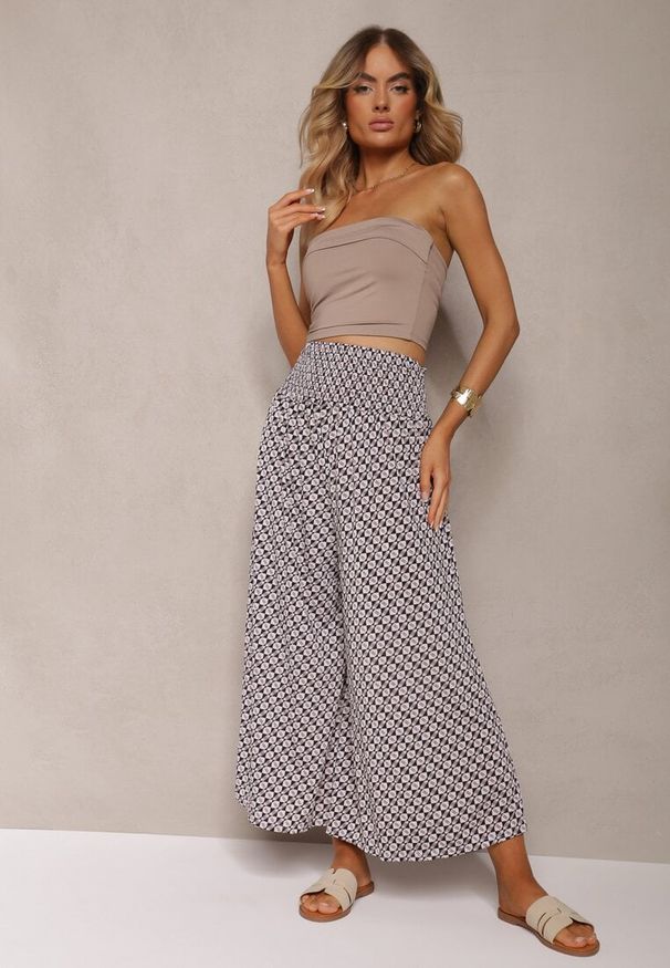 Renee - Czarno-Beżowe Spodnie High Waist z Bawełny z Rozszerzanymi Nogawkami i Gumką Nereialla. Stan: podwyższony. Kolor: czarny. Materiał: bawełna. Wzór: aplikacja