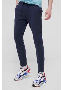 Tommy Jeans Spodnie męskie kolor granatowy joggery. Kolor: niebieski. Materiał: bawełna