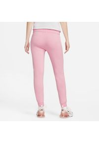 Nike - Spodnie Mid-Rise Slim Rozmiar M Różowy - DQ5174-690. Kolor: różowy. Materiał: materiał. Sport: fitness