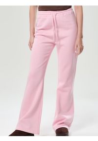 Sinsay - Spodnie flare - różowy. Kolor: różowy