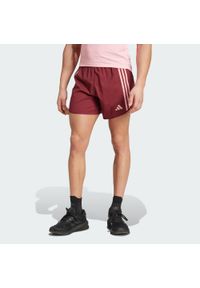 Adidas - Szorty Own the Run 3-Stripes. Kolor: czerwony. Materiał: materiał. Sport: bieganie