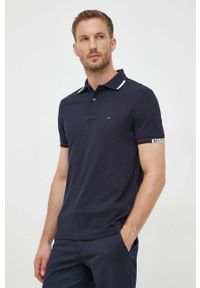 TOMMY HILFIGER - Tommy Hilfiger polo męski kolor granatowy gładki. Typ kołnierza: polo. Kolor: niebieski. Materiał: bawełna. Długość: krótkie. Wzór: gładki #1