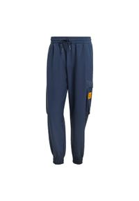 Adidas - Spodnie Real Madrid Seasonal Cargo. Kolor: niebieski. Materiał: materiał. Sport: piłka nożna