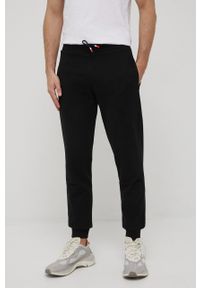 Rossignol spodnie dresowe bawełniane męskie kolor czarny gładkie. Kolor: czarny. Materiał: bawełna, dresówka. Wzór: gładki #1