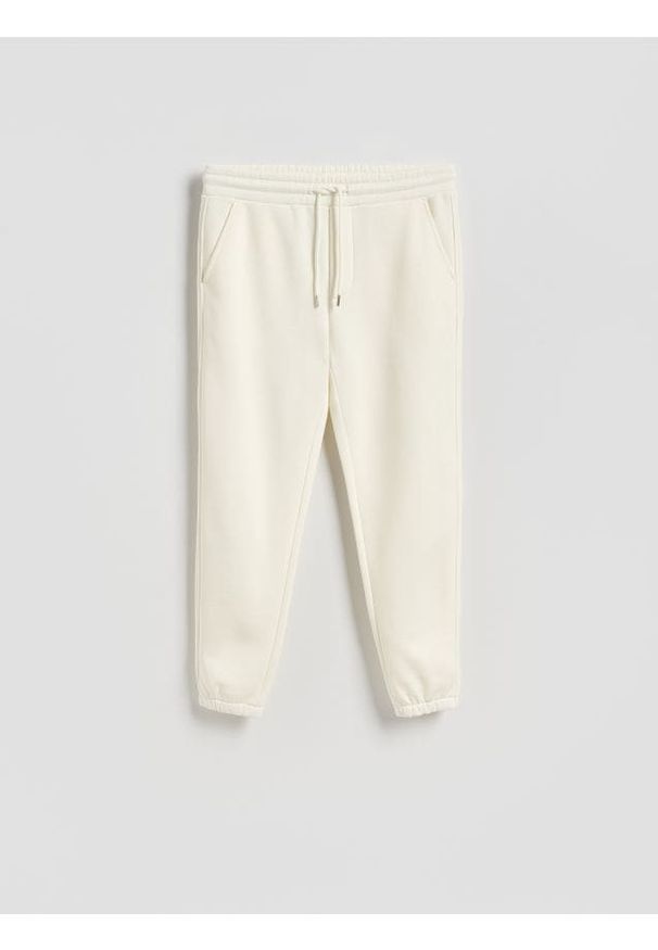 Reserved - Spodnie dresowe regular fit - złamana biel. Materiał: dresówka