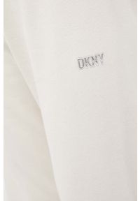 DKNY - Dkny spodnie dresowe kolor beżowy gładkie. Kolor: beżowy. Materiał: dresówka. Wzór: gładki #2