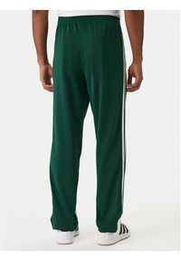 Adidas - adidas Spodnie dresowe Firebird KD8317 Zielony Loose Fit. Kolor: zielony. Materiał: syntetyk #5