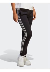 Adidas - adidas Spodnie dresowe Essentials 3-Stripes French Terry Cuffed Joggers IC8770 Czarny Slim Fit. Kolor: czarny. Materiał: bawełna #8