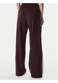 Adidas - adidas Spodnie dresowe Firebird KG3706 Brązowy Loose Fit. Kolor: brązowy. Materiał: syntetyk #2