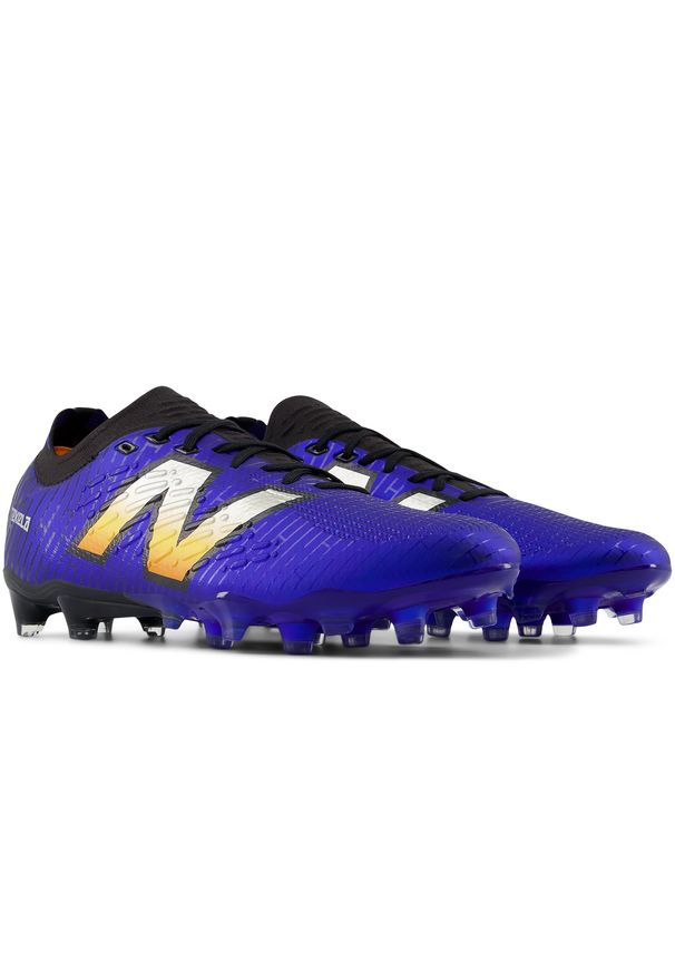 Korki męskie New Balance TEKELA PRO FG V4+ ST1FLZ45 – niebieskie. Kolor: niebieski. Materiał: materiał, nylon, guma, włókno. Szerokość cholewki: normalna. Sport: bieganie