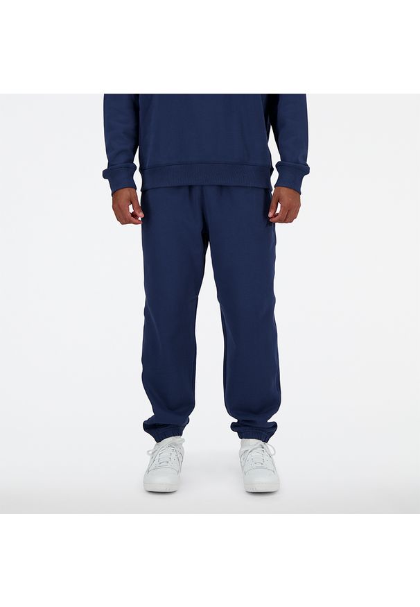 Spodnie męskie New Balance MP41508NNY – granatowe. Kolor: niebieski. Materiał: tkanina, dresówka, bawełna