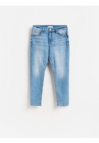 Reserved - Jeansy slim fit z efektem sprania - niebieski. Kolor: niebieski