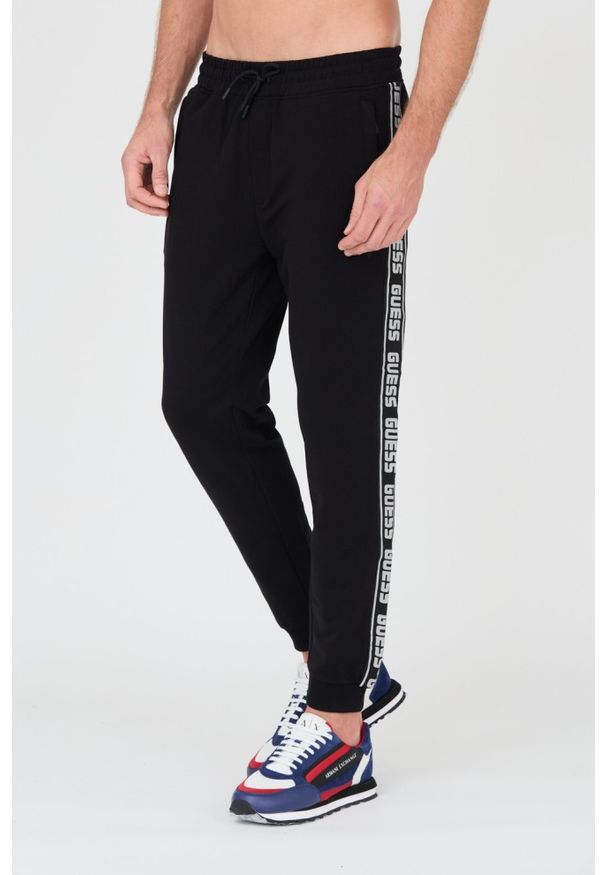 Guess - GUESS Czarne męskie spodnie dresowe, Rozmiar XXL. Kolor: czarny. Materiał: dresówka