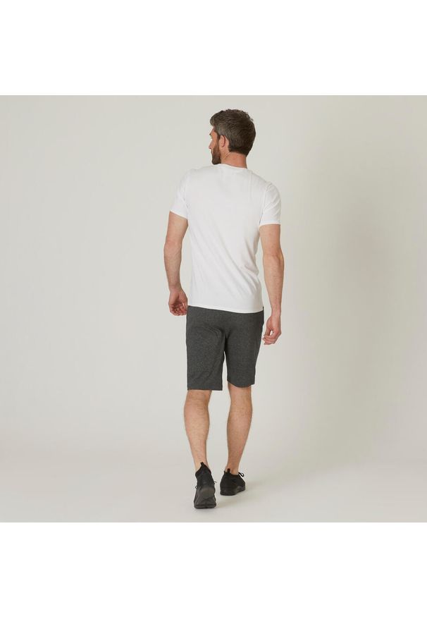 DOMYOS - Koszulka z krótkim rękawem męska Domyos Gym & Pilates 500 slim. Kolor: biały. Materiał: poliester, bawełna, materiał, elastan. Długość rękawa: krótki rękaw. Długość: krótkie. Sport: joga i pilates