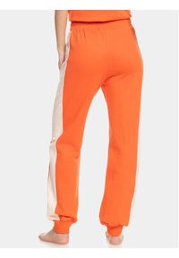 Roxy Spodnie dresowe Ess Nrj Cbk Jog Otlr ERJFB03366 Pomarańczowy Regular Fit. Kolor: pomarańczowy. Materiał: bawełna. Sport: joga i pilates
