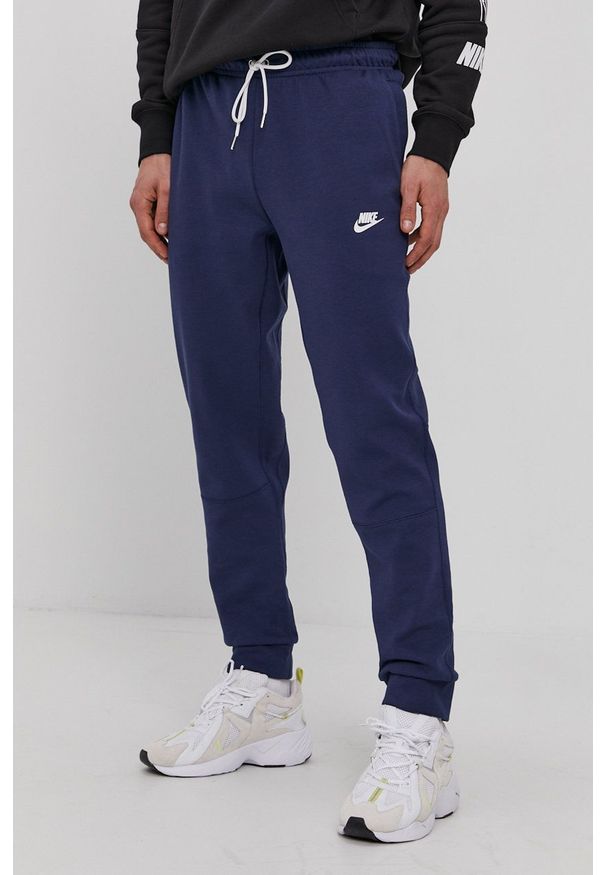 Nike Sportswear - Spodnie. Kolor: niebieski. Materiał: materiał