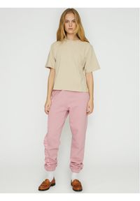 Spodnie dresowe ROTATE. Kolor: różowy. Materiał: bawełna, dresówka #1