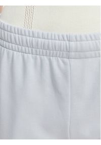 Lacoste Spodnie dresowe XF7604 Niebieski jasny Regular Fit. Kolor: niebieski. Materiał: bawełna #4