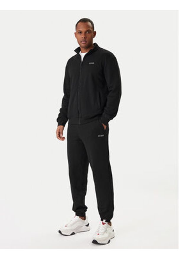 Guess Spodnie dresowe Z6RB12 KAIJ1 Czarny Regular Fit. Kolor: czarny. Materiał: bawełna