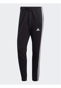 Adidas - adidas Spodnie dresowe Essentials French Terry Tapered Elastic Cuff 3-Stripes Joggers IC0050 Czarny Regular Fit. Kolor: czarny. Materiał: bawełna, dresówka #6